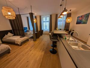 Postel nebo postele na pokoji v ubytování Flataid Apartment Obere Bahnstraße - Grazer Messe