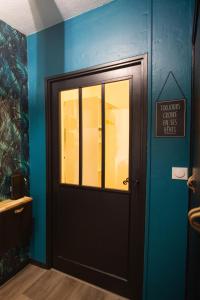 a door in a room with a sign on it at Vercors et Vous in Saint-Jean-en-Royans +75 photos