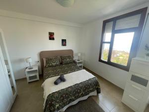 Postel nebo postele na pokoji v ubytování 2 Dormitorios - Vistas Mar, Montaña y Volcán + 19 fotografií