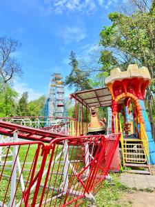 a playground with a colorful roller coaster at Central Home with Underground Parking in Varna City