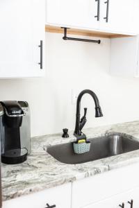 a kitchen counter with a sink and a toaster at Latitude Adjustment in Virginia Beach