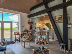 a room with a table and chairs and a window at Seaside Retreat & Hotel in Stege