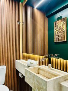 a bathroom with a sink and a toilet at Vita Boulevard Gramado in Gramado