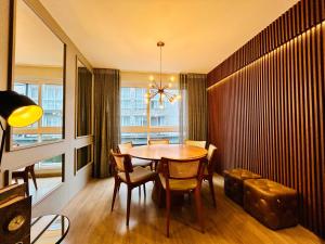 a dining room with a table and chairs and a window at Vita Boulevard Gramado in Gramado +64 photos