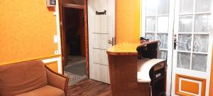 a room with a desk and a door to a hallway at Hôtel Résidence Saint Ouen in Saint-Ouen +24 photos