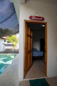a door leading to a pool in a house at Apartamento de playa con piscina privada in Monterrico