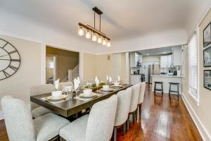 a dining room with a long table and chairs at 5 Mi to Dtwn Detroit Pet-Friendly Edison Home in Highland Park