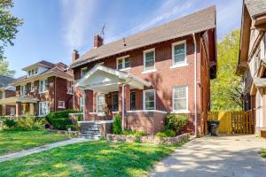 a red brick house with a white awning at 5 Mi to Dtwn Detroit Pet-Friendly Edison Home in Highland Park
