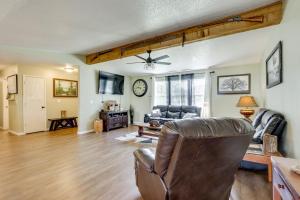 a living room with a couch and a chair at 1 Mi to Shops and Cafes Updated Cassville Home! in Cassville
