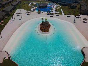 an aerial view of the pool at a resort at Morro dos Anjos Águas Quentes Hotel Resort in Bandeirantes