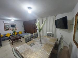 a living room with a dining table and a couch at Residencia en Mitras Poniente García in Monterrey +30 photos