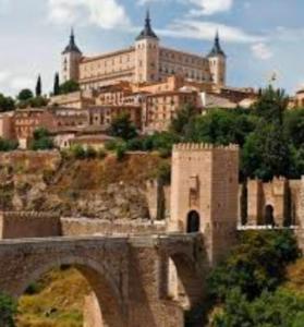 a large building on top of a hill with a bridge at Bulas 24 in Toledo