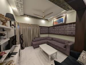 a living room with a couch and a table at Dream house 