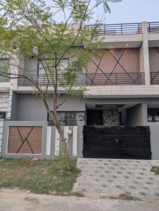 a house with a tree in front of it at Dream house 