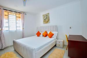 Postel nebo postele na pokoji v ubytování RICI HOMES Da-Azizi apartment