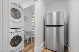 a kitchen with a refrigerator and a washer and dryer at Pittsburgh Shadyside 2A Bright and Stylish Private Bedroom with Shared Bathroom in Pittsburgh +4 photos
