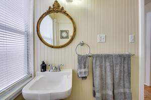 a bathroom with a sink and a mirror at Less Than 1 Mi to Dtwn Bradenton and Riverwalk! Sunny Apt in Bradenton
