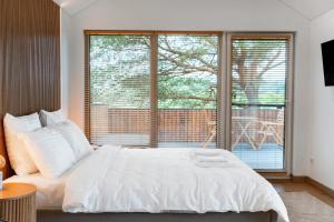 Katil atau katil-katil dalam bilik di Nemunas Glamping