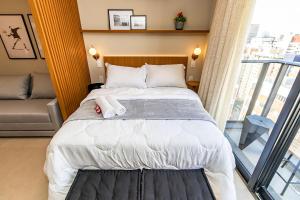 Ένα ή περισσότερα κρεβάτια σε δωμάτιο στο Studio Premium p/ 4 pessoas no All Batel - BAT1816