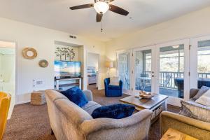 a living room with couches and a ceiling fan at Beaches and Birdies in North Myrtle Beach