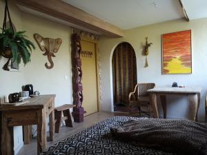 a living room with a table and a table and a table sidx sidx at South African Room in Westbeemster