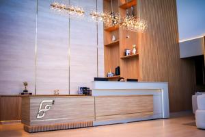 a store with a reception desk in a room at Farms Hotel in Coribe