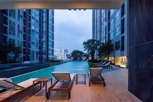 a view of a swimming pool in a building at THE BASE Central Pattaya Sea View Holiday Residences in Pattaya Central +71 photos