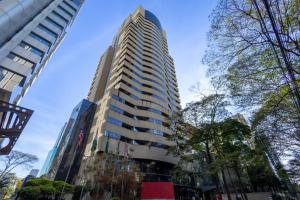 a tall building on a city street with trees at Hotel Transamerica Berrini in São Paulo +34 photos