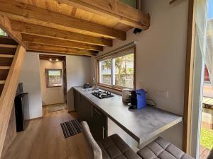 a kitchen with a counter top in a house at Tiny Surf in Punaauia