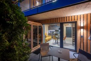 a house with a view of the living room and dining room at TinyHome Singer - inclusive private Sauna in Ehenbichl