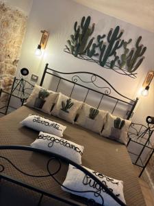 a bedroom with a bed with pillows on it at Dimore Levante Borgobianco in Turi