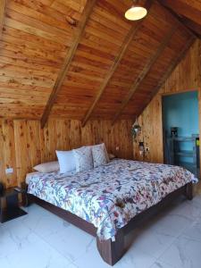 Postel nebo postele na pokoji v ubytování Cabaña El Trogon