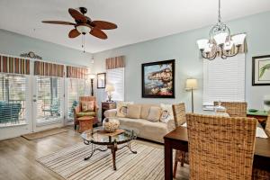 a living room with a couch and a table at Tidewater 1911 in The Old Home Place