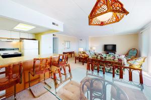a kitchen and living room with a table and chairs at Ocean Place 401 in Ocean City