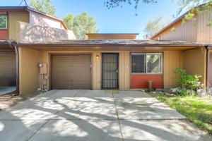 a house with a garage and a driveway at Flagstaff Townhome with Grill about 3 Mi to Downtown! in Flagstaff