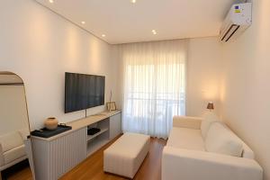 Телевизор и/или развлекательный центр в A6/404-Cobertura Duplex ao lado MorumBIS Einstein com Jacuzzi