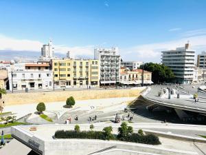 a view of a city with buildings at Plateia Suite Verde in Nicosia