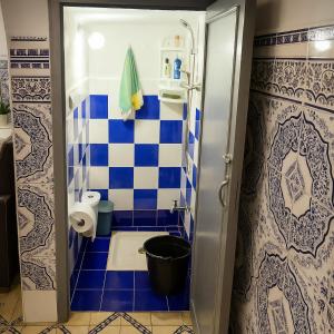 a small bathroom with a blue and white tiled wall at DAR Souaad Bab Doukkala in Marrakech