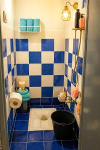 a blue and white bathroom with a toilet and a tub at DAR Souaad Bab Doukkala in Marrakech