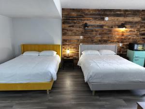 Ένα ή περισσότερα κρεβάτια σε δωμάτιο στο Bel Aire Motel