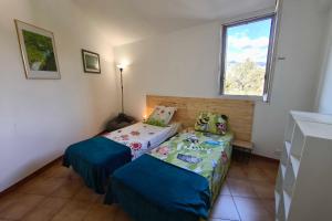 Ένα ή περισσότερα κρεβάτια σε δωμάτιο στο Bright apartment with two bedrooms in Ajaccio +3 φωτογραφίες