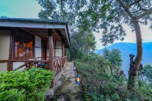 a house on a hill with a view of the mountains at Gorilla Retreat Ecolodge -Bwindi Forest in Bwindi