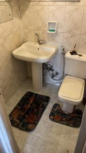 a bathroom with a sink and a toilet at Aisha guesthouse in Aswan