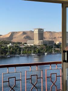 a view of a river from a balcony at Aisha guesthouse in Aswan