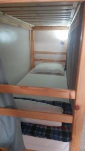 a couple of bunk beds in a room at Habibi Hostel in Taghazout +77 photos