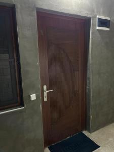 a wooden door in a hallway of a building at Grigor's Guestgouse in Yerevan