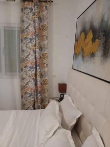 Ένα ή περισσότερα κρεβάτια σε δωμάτιο στο Chambre meublée