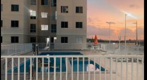 a pool on the balcony of a building at Residência da day in Aracaju