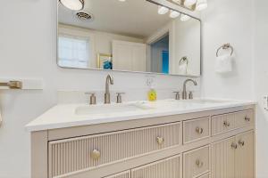 a bathroom with a sink and a mirror at Town of Rehoboth Beach --- 33 Maryland Ave in Rehoboth Beach +16 photos