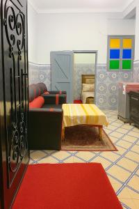 a rendering of a living room with a couch and a table at DAR Souaad Bab Doukkala in Marrakech